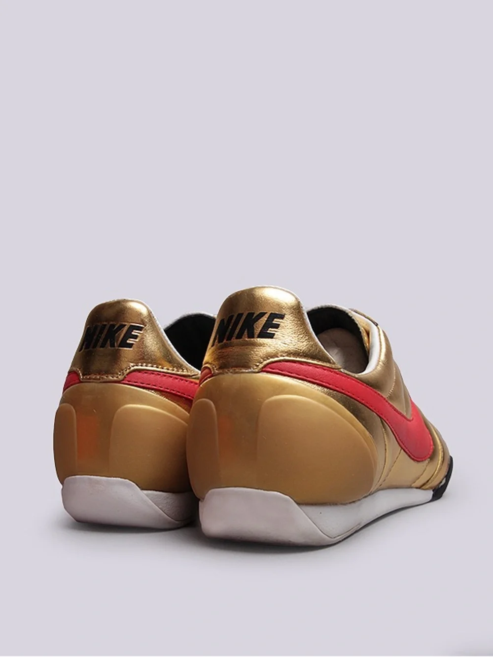 Nike Gold Leather Sneaker with Red Swoosh and White Laces